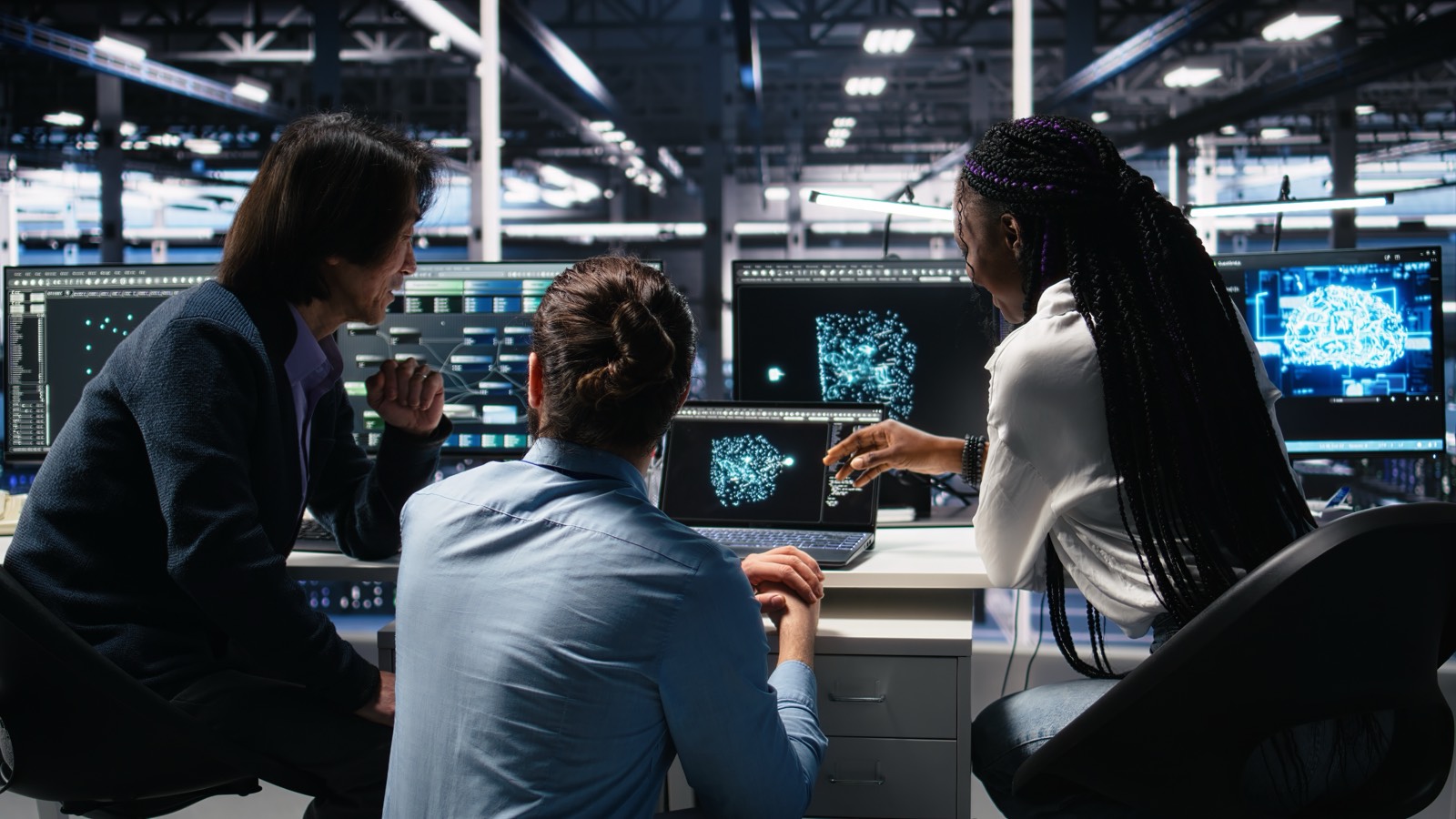 A team collaborating over screens at Times Printers